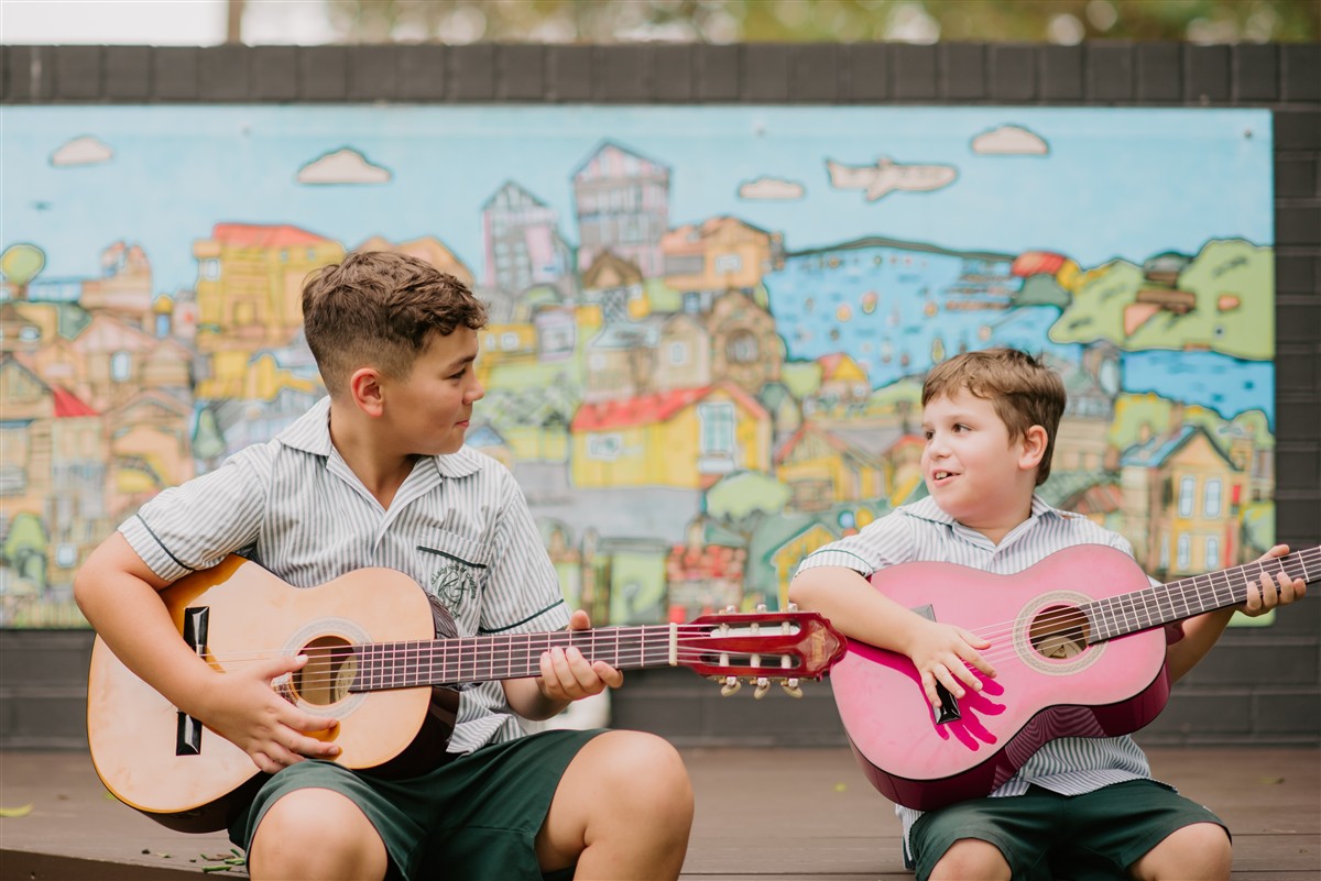 Students playing guitar